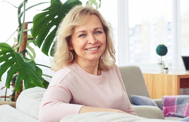 Woman supporting her gut health with Bioma Probiotics